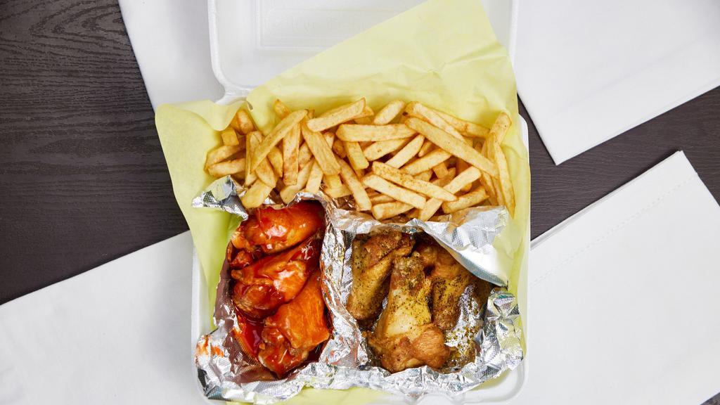 Chicken Wings · Bone in Wings served with ranch and a side of fries.