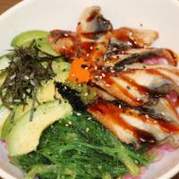 Eel Bowl (Unagi) · Eel, seaweed salad, avocado, seaweed, and masago bedded on rice  with eel sauce