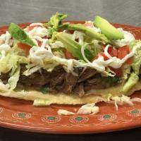 Huarache · THICK  KRISPY HAND MADE TORTILLA TOPPED WITH YOUR CHOICE OF MEAT, BEANS, LETTUCE, SOUR CREAM,