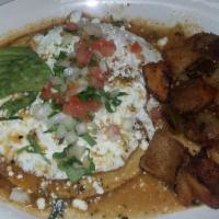 Huevos Rancheros · Two scrambled eggs served over a crispy corn tortilla then topped with our signature rancher...