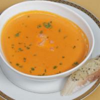 Lobster Bisque · French style bisque with fresh lobster served with garlic bread.