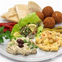 Appetizer Platter · Hummus, Baba Ghanoush, Kibbeh, Falafel, Grape Leaves, Tabbouleh and Pita Bread.