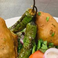 Chicken Samosa (2Pcs) · Hand rolled pastry stuffed with vegetables with Chicken.