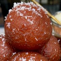 Gulab Jamun · Soft milk balls soaked in syrup