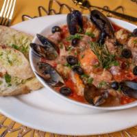 Cazuela De Mariscos · Tomato based soup with Shrimp, Mussels and Fish.