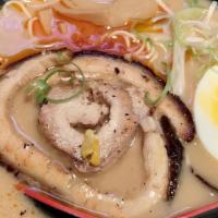 Spicy Miso Ramen · Two pieces chashu, soft boiled egg, fish cake, corn and bamboo shoot.