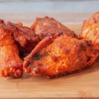 Boneless Wings · Plump, tender all white meat boneless chicken, breaded and baked, then tossed in your favori...
