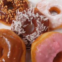 Fancy Donut · Maple / Pink / White icing donuts, Chocolate glazed  donuts with peanut / coconut topping