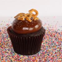 Caramel Crunch · Chocolate cake with caramel frosting topped with sea salt and pretzels.