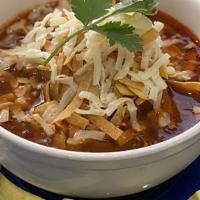 Tortilla Soup · Our house made Chicken Tortilla Soup with avocado topped with tortilla strips & jack cheese.
