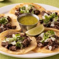 Street Tacos · Five corn tortillas topped with either grilled beef or chicken with diced onions and chopped...