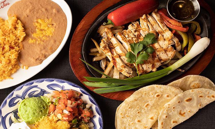 1/2 Lb Chicken Fajitas · Our Grilled Chicken Fajitas. Served with homemade tortillas, Mexican Rice, and Choice of Beans.