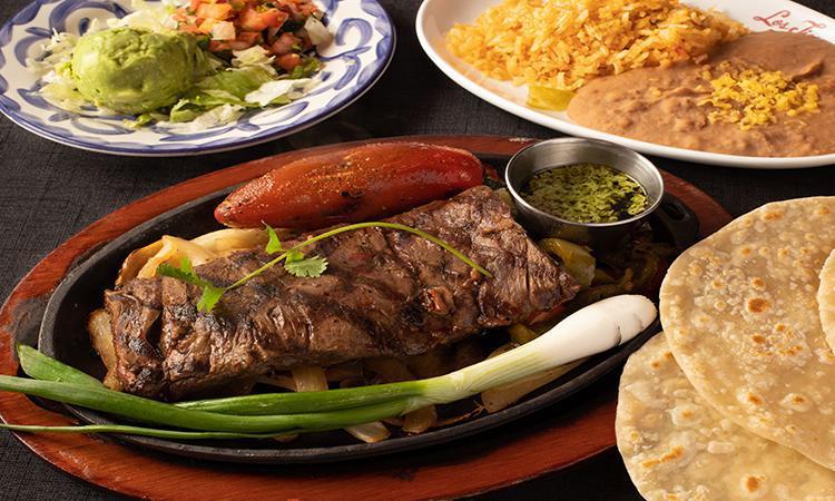 Carne Asada Dinner · Black Angus Skirt Steak served with Pico d Gallo, Guacamole, homemade tortillas, Mexican Rice, and Choice of Beans.