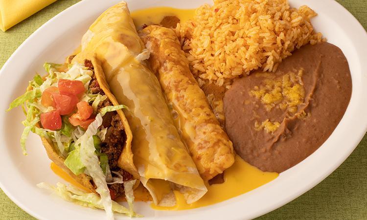 Tex Mex Dinner · Taco al carbon topped with chili con queso, crispy beef taco, and a cheese enchilada. Served with refried beans and Mexican rice.