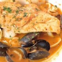 Seafood Paella · prawns, scallops, clams, mussels, calamari, Spanish chorizo, peppers, peas, saffron rice