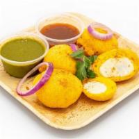 Egg Bonda (6 Pc) · Boiled Eggs fried with coated lentil batter (6 pc) and served with mint chutney