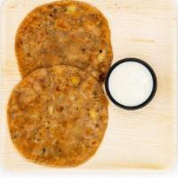 Aloo Paratha · Unleavened wheat dough stuffed w/ a spiced mixture of mashed potato rolled out & cooked on a...