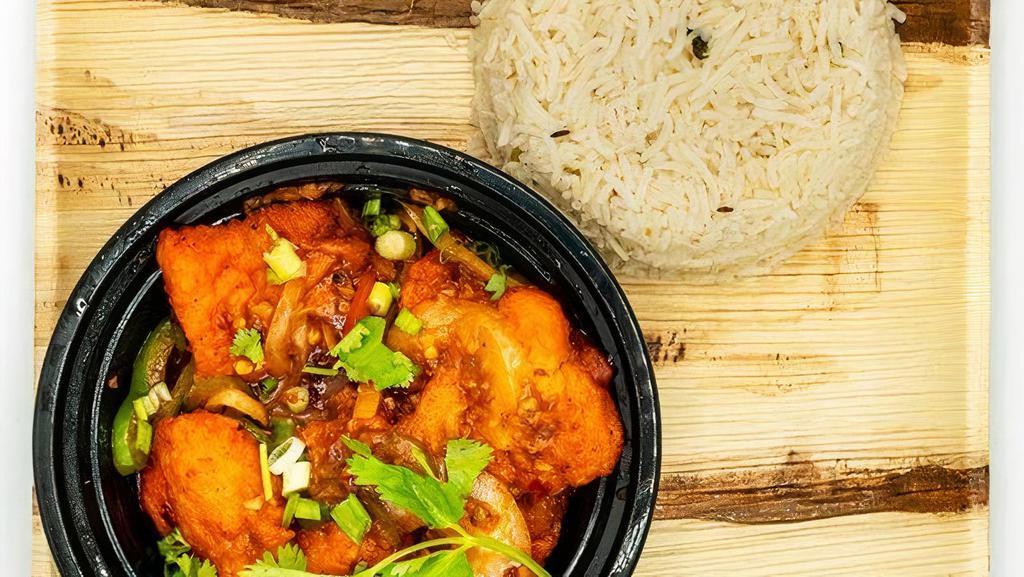 Chilli Fish · Spiced & battered fish cubes cooked w/ capsicum, onion & special chilli sauce, topped w/ shreds of ginger & cilantro.
Served with Rice Pilaf.