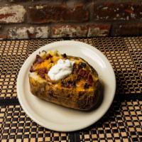 Bbq Baked Potato · Giant Idaho baked potato with cheese, sour cream, butter, and bacon and 1/3 lb of your choic...