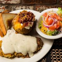 Chicken Fried Steak Dinner · Fresh locally sourced steak cutlet, hand breaded and smothered in country gravy with baked p...