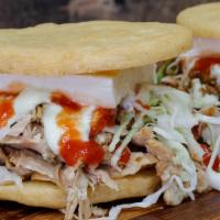 Arepitas Fritas De Pernil Y Queso 1 Ct · Deep fried corn arepa, filled with bake pork (pernil), de mano cheese, cabbage and homemade ...