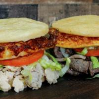 Arepitas Fritas Especiales · Deep fried arepa filled with the protein of your choice, fried cheese, tomato, lettuce and h...
