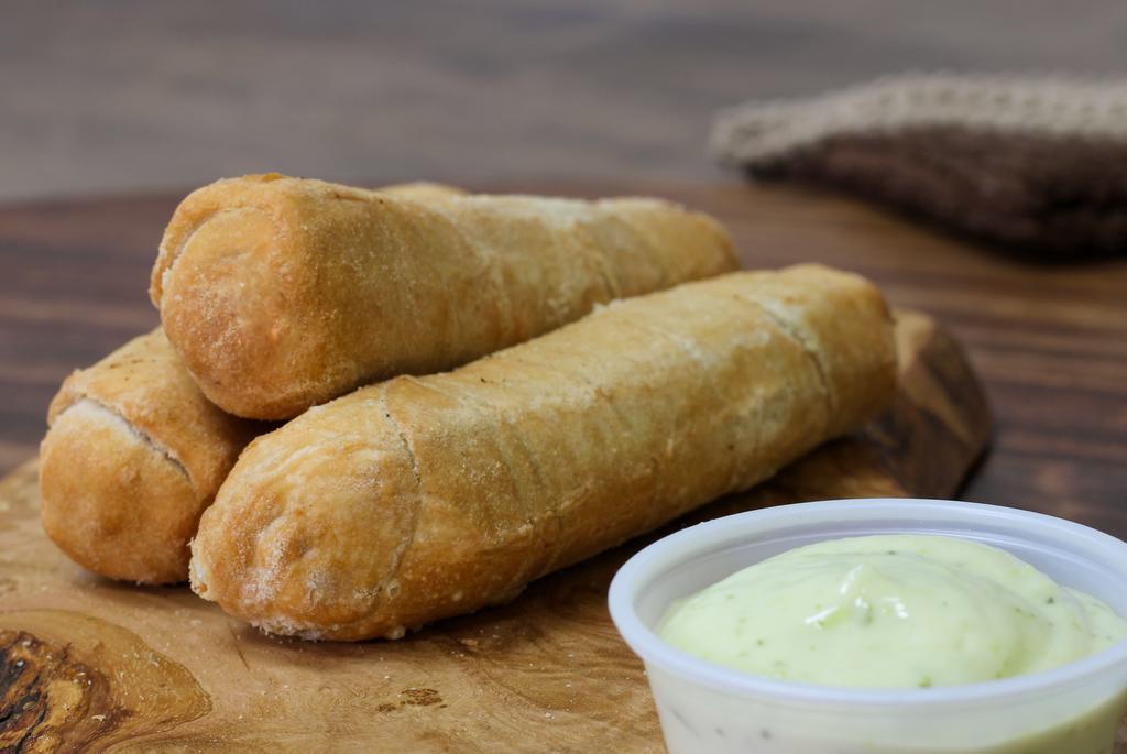 Servicio De 3 Tequenos · Cheese fingers wrapped in a soft fried dough.