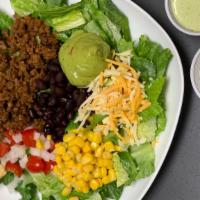 Taco Salad · Seasoned ground beef, chopped romaine lettuce, corn kernels, black beans, pico de Gallo, shr...