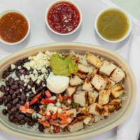 Chargrilled Citrus Chicken Bowl · Marinated citrus chargrilled chicken served with cilantro lime rice and black beans topped w...