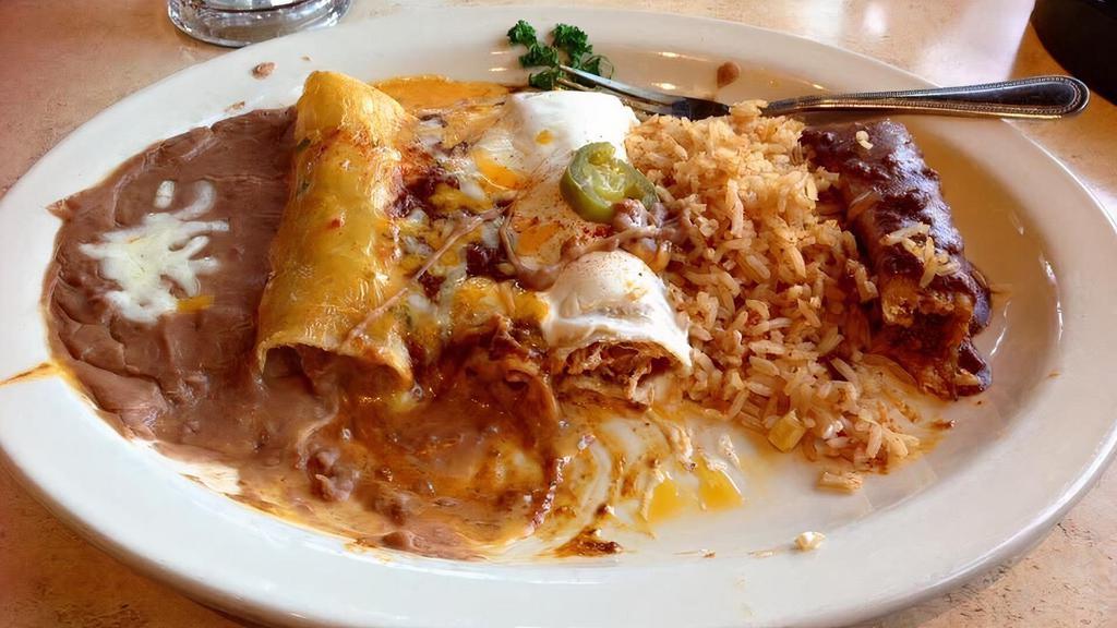 Cheese Enchiladas · Three cheese enchiladas with chile con carne, Mexican rice and refried beans.