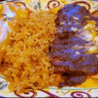 Tampico · Two cheese enchiladas with chile con carne, one beef enchilada topped with chile con queso, ...