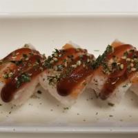 Samurai Roll · Spicy. Tuna, crab meat, avocado and cucumber in soy paper topped with salmon.