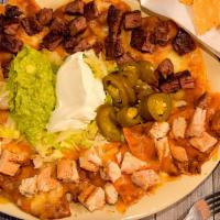 Bean And Cheese Nachos · Comes with refried beans and cheese.