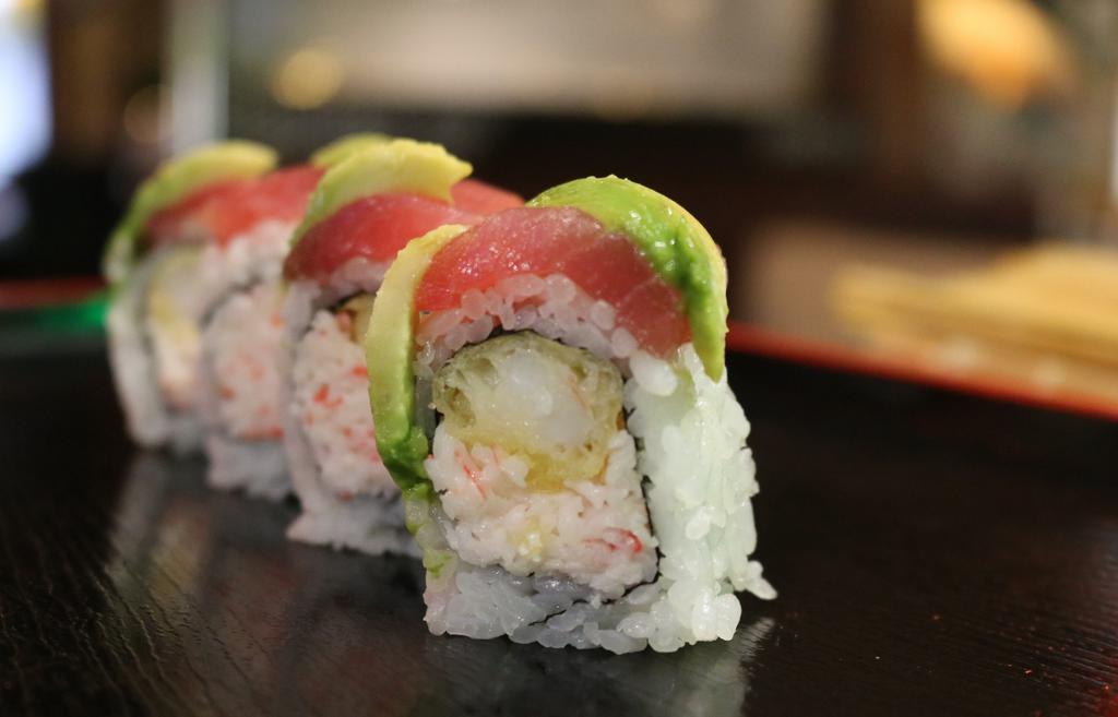 Geisha Roll · Shrimp tempura, crab, topped with tuna and eel, spicy mayo, wasabi mayo, hot sauce