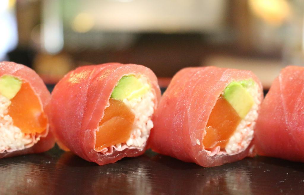 Love Love Roll · crab meat, fresh salmon, wrapped in fresh tuna and soy paper with spicy miso sauce