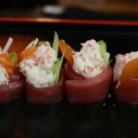 Red Rose Roll · Salmon, crab meat, cucumber, avocado wrapped in tuna w/special sauce (no rice)