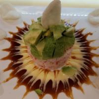 Crab Tower · No rice. Comprised layers of crabmeat and avocado topped with mango sauce and eel sauce serv...