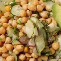 Chickpeas Aguachiles · Sprouted chickpeas, cucumber, Serrano pepper, lime, avocado, cilantro and red onion.