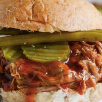 Sweet Pulled Pork Sandwich · Brioche, pulled pork, pickles, provolone, onions and honey BBQ.