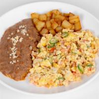 Huevos A La Mexicana · Served with beans and potato breakfast. Eggs with tomato, onions, jalapeño, and flour or com...