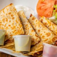 Quesadilla · Melted white and yellow cheese with any of your choice of meat. Served with a side of lettuc...
