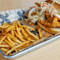 Catfish Po-Boy · Choose Fried or Blackened Fish with lettuce,
pickles, tomatoes & rémoulade sauce on toasted ...