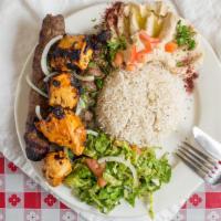 Mix Grill · Three skewers of your choice, chicken or beef kabbab with rice, bread, hummus, and salad.