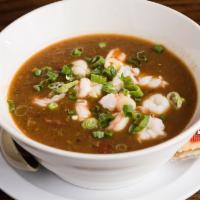 Gumbo · A traditional cajun favorite with shrimp, sausage, and okra in a dark roux served with white...