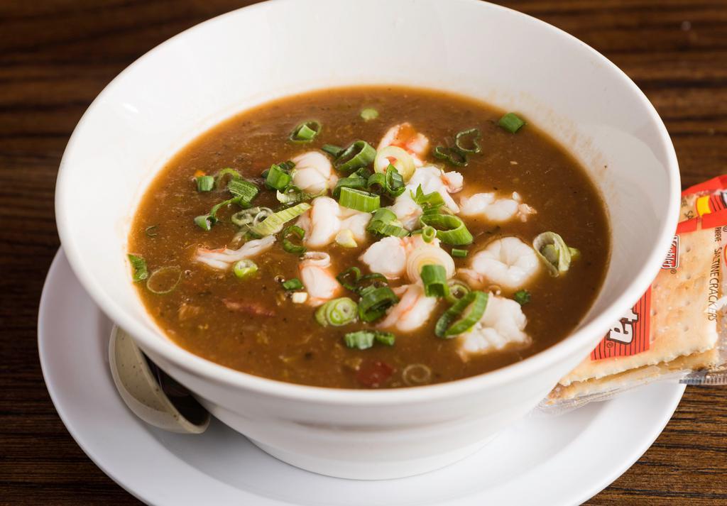 Gumbo · A traditional cajun favorite with shrimp, sausage, and okra in a dark roux served with white rice.