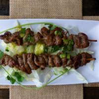 Beef Satay · Marinated beef on 2 skewers, grilled and served with peanut sauce.