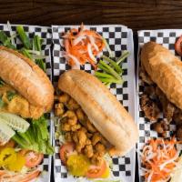Po-Boy Basket · Your choice of oyster, crawfish, shrimp or catfish deep-fried and served in a baguette dress...