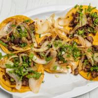 Street Tacos · Small corn tacos with choice of meat, includes grilled onions and cilantro.