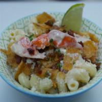 Lobster · Smoked gouda, lobster, pico, cilantro, bacon, crumbled chips and cotija.