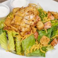 Grilled Chicken Salad · Tossed green salad with shredded cheese, tomatoes, and croutons, topped with a marinated, gr...